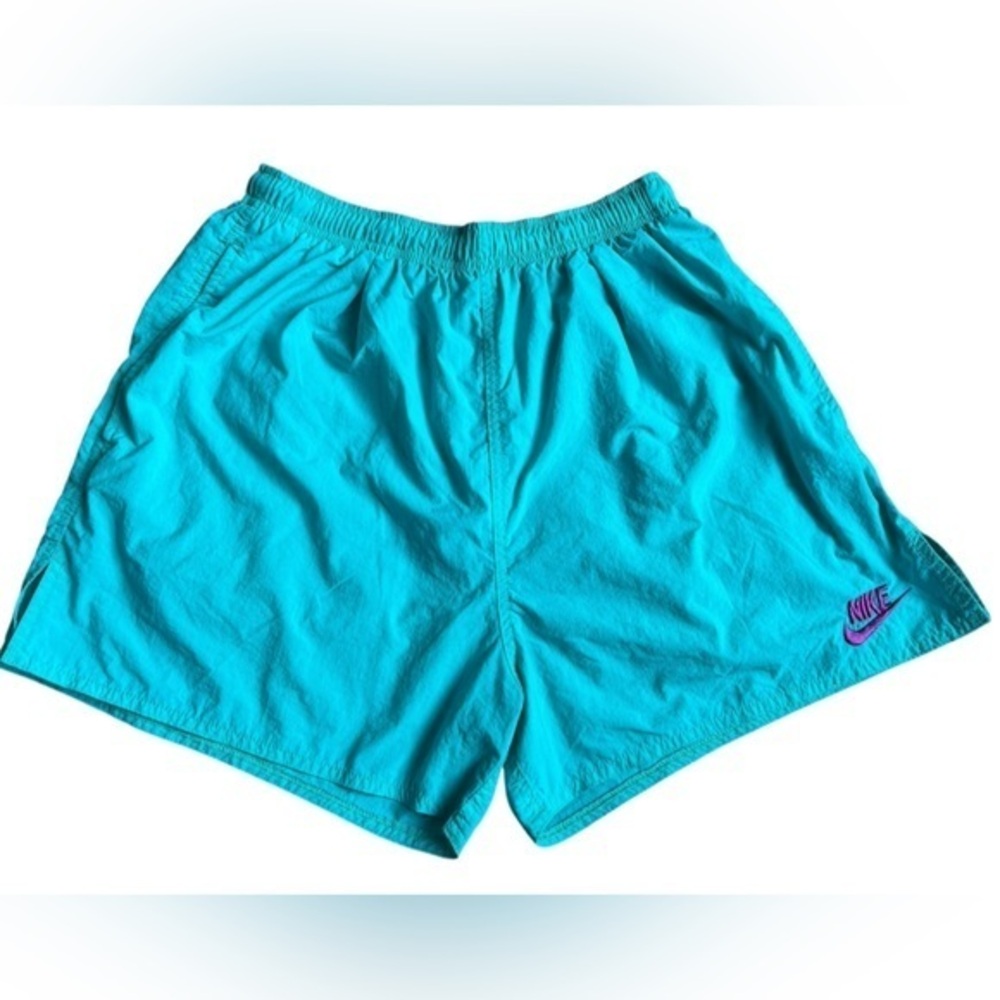 Nike women’s teal nylon short size medium.